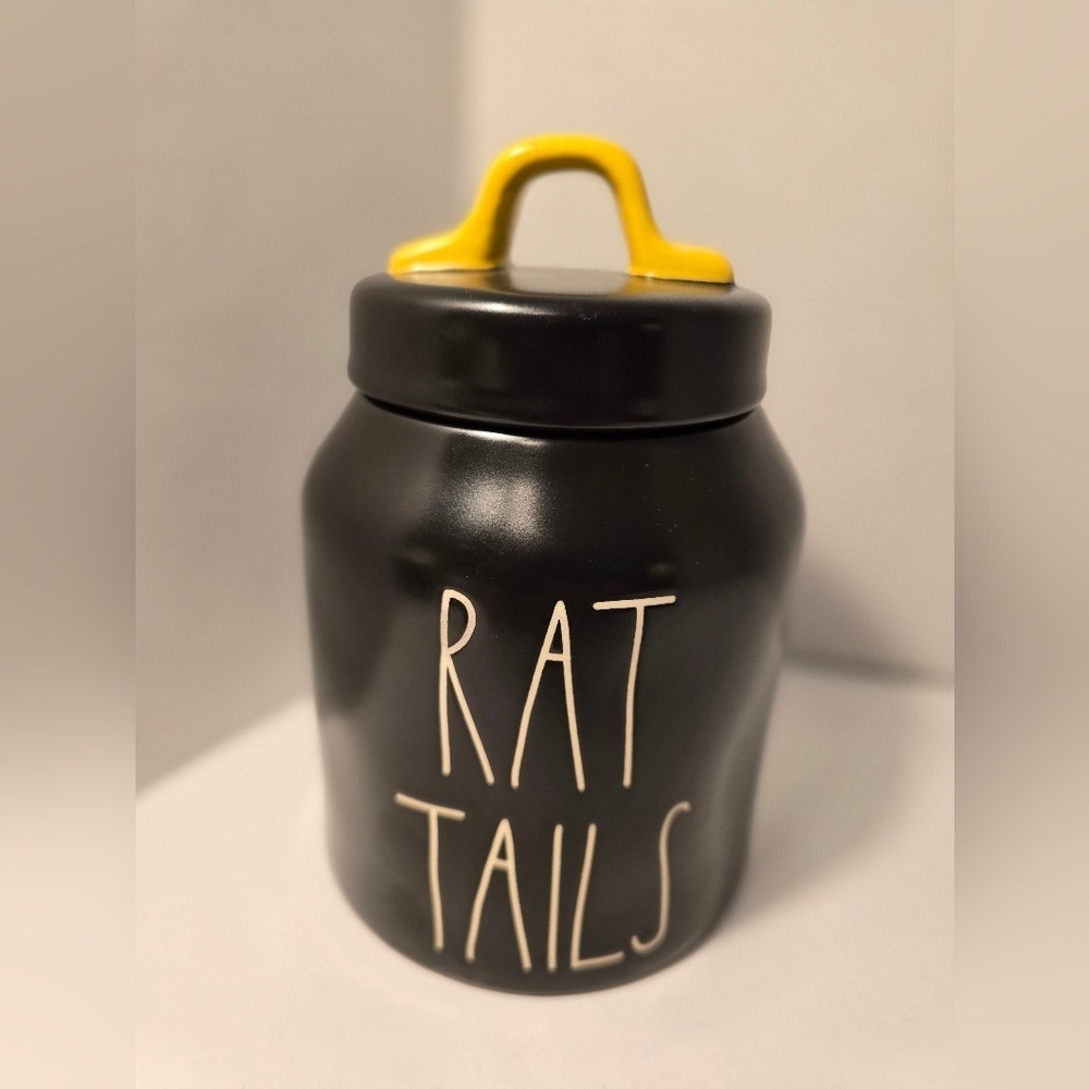 Rae Dunn Black Canister with Yellow Handle 'RAT TAILS' text